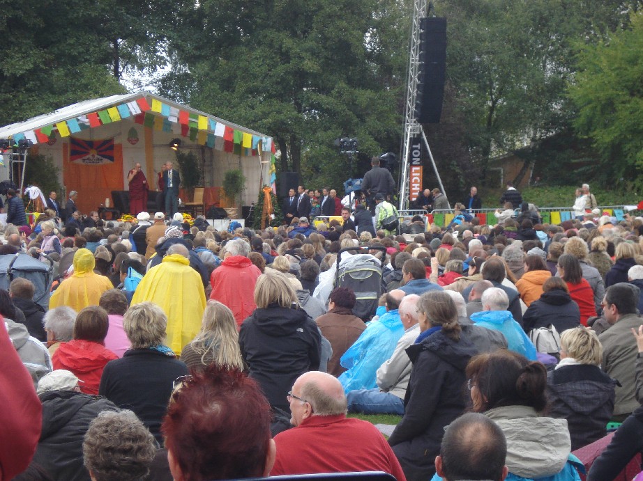 There he is, the real Dalai Lama, on stage at what feels a bit like a pop concert. 