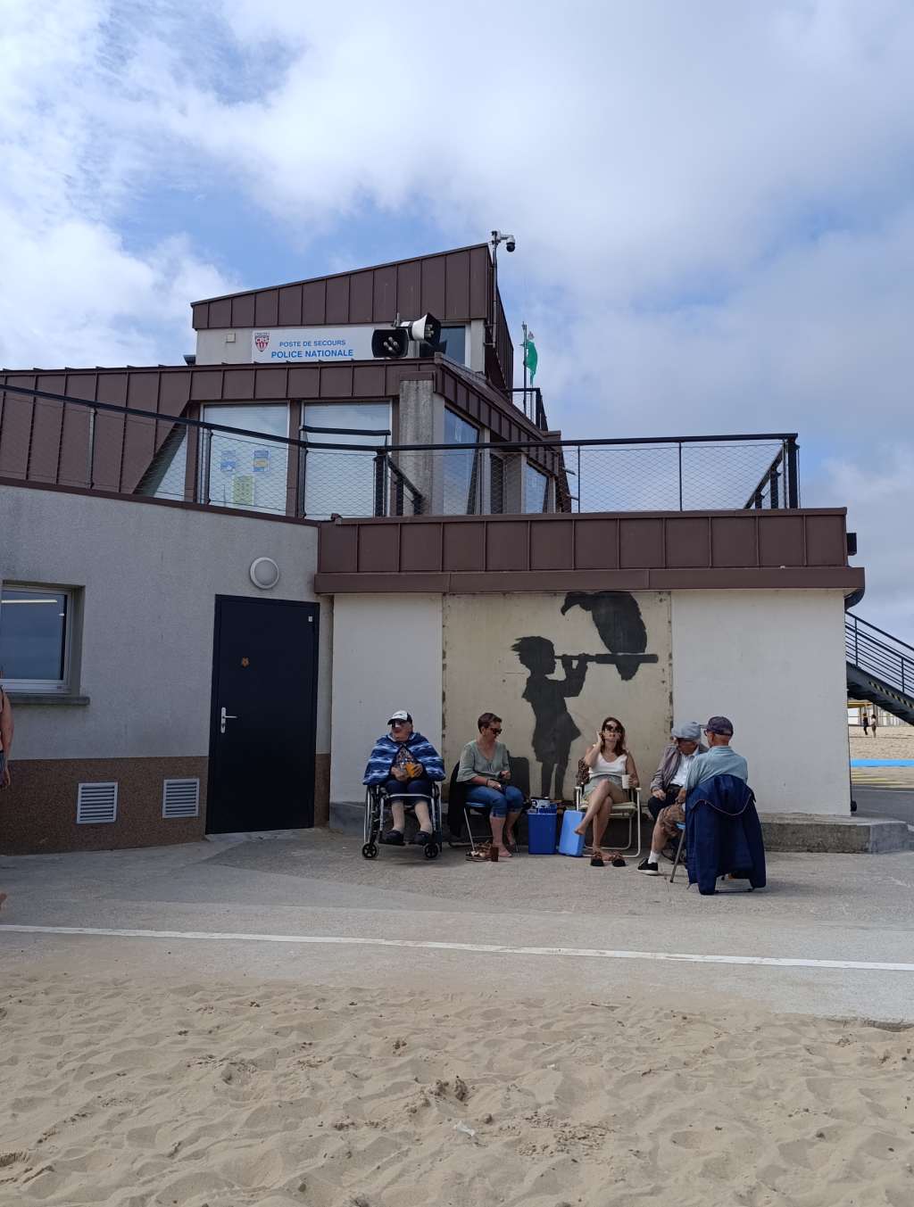 calais banksy child with telescope